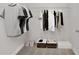 Bright walk-in closet with shelf and clothes rack, along with containers for storage at 61 Colonial Terrace, Villa Rica, GA 30180