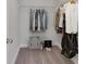 Bright walk-in closet featuring shelving and racks to hang and organize clothes at 61 Colonial Terrace, Villa Rica, GA 30180