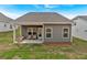 Backyard features a covered patio and green grass at 71 Colonial Terrace, Villa Rica, GA 30180