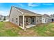 Backyard features a covered patio with comfortable seating at 71 Colonial Terrace, Villa Rica, GA 30180