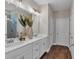 Stylish bathroom with dual sinks, white cabinetry, and modern fixtures at 71 Colonial Terrace, Villa Rica, GA 30180