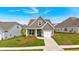 Charming single Gathering home with well-maintained lawn and attractive gray siding at 71 Colonial Terrace, Villa Rica, GA 30180