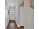 Entryway featuring hardwood flooring, neutral paint, and white trim, with a glass door at 71 Colonial Terrace, Villa Rica, GA 30180