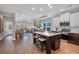 Modern open-concept kitchen with a center island, pendant lighting, stainless steel appliances and hardwood floors at 71 Colonial Terrace, Villa Rica, GA 30180