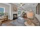 Bright living room featuring a fireplace, mantel and an open floorplan leading to the dining and kitchen areas at 71 Colonial Terrace, Villa Rica, GA 30180