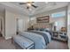 Comfortable main bedroom with large windows and decorative tray ceilings at 71 Colonial Terrace, Villa Rica, GA 30180