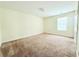 Spacious bedroom with neutral carpet, closet space, and natural light at 125 Whistle Way, Locust Grove, GA 30248