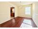 Dining room with hardwood floors, pendant light, and window at 125 Whistle Way, Locust Grove, GA 30248