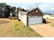 Well-maintained home featuring stone accents, a two-car garage, and a spacious backyard at 125 Whistle Way, Locust Grove, GA 30248