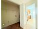 Bright laundry room with washer and dryer hookups, access to kitchen, and tile flooring at 125 Whistle Way, Locust Grove, GA 30248