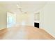 Spacious living room featuring a vaulted ceiling, fireplace, and neutral carpet at 125 Whistle Way, Locust Grove, GA 30248