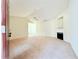 Inviting living room with a fireplace, vaulted ceilings, and neutral carpeting at 125 Whistle Way, Locust Grove, GA 30248