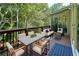 Staged back deck with seating, wood railing and wooded view at 190 Winford Close, Duluth, GA 30097