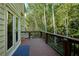 Wide back deck overlooking wooded backyard at 190 Winford Close, Duluth, GA 30097