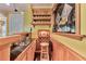 Basement wet bar features dark granite counters, wine rack, and storage for your favorite spirits and vintages at 190 Winford Close, Duluth, GA 30097