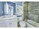 Stylish bathroom featuring a shower-tub, sink, commode, linen cabinet and light blue paint at 190 Winford Close, Duluth, GA 30097