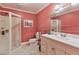 Bathroom featuring a shower, vanity sink, and tile flooring, offering functionality and simple elegance at 190 Winford Close, Duluth, GA 30097