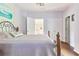 Comfortable bedroom with a cozy bed, hardwood floors and bright natural lighting at 190 Winford Close, Duluth, GA 30097