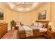 Bedroom featuring hardwood floors, a decorative ceiling, and neutral decor, creating a cozy and inviting retreat at 190 Winford Close, Duluth, GA 30097
