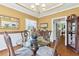 Elegant dining room with glass table, chandelier, and hardwood floors, perfect for formal dinners at 190 Winford Close, Duluth, GA 30097