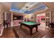 Finished basement game room features a billiard table, hardwood floors, and ample space for entertainment at 190 Winford Close, Duluth, GA 30097