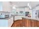 Well-lit kitchen with granite countertops, stainless steel appliances, island, and modern cabinetry at 190 Winford Close, Duluth, GA 30097