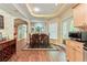Eat-in kitchen featuring wood cabinets, stainless steel appliances, and a dining area at 190 Winford Close, Duluth, GA 30097