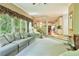 Open living room and kitchen layout with a sofa, massage chair, and natural light creating a calming atmosphere at 190 Winford Close, Duluth, GA 30097