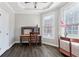 Well-lit office features modern flooring, a ceiling fan, and bright, natural light from two large windows at 190 Winford Close, Duluth, GA 30097
