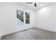 Light-filled bedroom featuring hardwood floors and a double window view at 240 Grogans Lake Pt, Sandy Springs, GA 30350