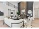 Modern living room with a floor-to-ceiling accent wall, fireplace, and elegant decor at 240 Grogans Lake Pt, Sandy Springs, GA 30350