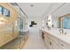 Open main bathroom featuring dual vanities, soaking tub and a large frameless shower at 240 Grogans Lake Pt, Sandy Springs, GA 30350