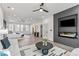 Luxury main bedroom featuring a sitting area, fireplace, and stunning backyard view at 240 Grogans Lake Pt, Sandy Springs, GA 30350