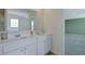 Bathroom with double vanity, plenty of counter space, and an adjacent bedroom at 2710 Serena Way, South Fulton, GA 30331