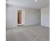 Large carpeted bedroom with bright natural light and neutral decor at 2710 Serena Way, South Fulton, GA 30331
