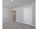 A cozy bedroom featuring plush gray carpeting and neutral walls at 2710 Serena Way, South Fulton, GA 30331