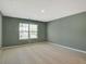 A light filled bedroom featuring neutral carpet and walls, and a window providing natural light at 2710 Serena Way, South Fulton, GA 30331