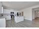 Open kitchen with stainless appliances, granite counters, and island with seating at 2710 Serena Way, South Fulton, GA 30331