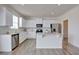 This spacious kitchen includes white cabinets, stainless steel appliances, and stone countertops at 2710 Serena Way, South Fulton, GA 30331