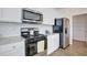 Modern kitchen featuring granite counters, stainless steel appliances and white cabinets at 2710 Serena Way, South Fulton, GA 30331