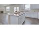 Open kitchen with granite countertops, white cabinets and stainless steel appliances at 2710 Serena Way, South Fulton, GA 30331