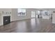 Open floor plan featuring hardwood floors, a fireplace, and plenty of natural light at 2710 Serena Way, South Fulton, GA 30331