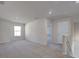 Upstairs loft area with plush carpeting, bright window, and access to several rooms at 2710 Serena Way, South Fulton, GA 30331
