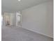 Upstairs loft area featuring laundry hookups and a neutral color palette at 2710 Serena Way, South Fulton, GA 30331