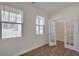 Bright office space featuring wood flooring, windows, and charming French doors at 2710 Serena Way, South Fulton, GA 30331