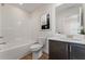 A clean, well-lit bathroom features a bathtub, toilet, sink, vanity, and neutral tones at 49 Masters Dr, Villa Rica, GA 30180
