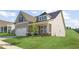 Charming home featuring a two-car garage, well-manicured lawn, and inviting front porch at 49 Masters Dr, Villa Rica, GA 30180