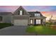 Charming home featuring a two-car garage, well-manicured lawn, and inviting front porch at 49 Masters Dr, Villa Rica, GA 30180