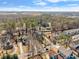 Aerial view of the property and neighborhood with mature trees and a distant skyline at 1265 Emerald Se Ave, Atlanta, GA 30316