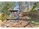 Cozy backyard with colorful Adirondack chairs, and a screened porch and lawn at 1265 Emerald Se Ave, Atlanta, GA 30316